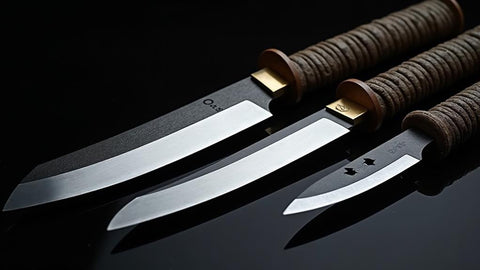 Collection of Japanese tanto blades showing variety of designs